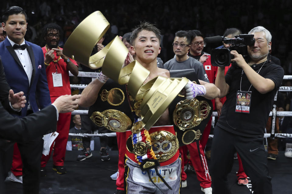 Japan's Naoya Inoue holds the Muhammad Ali Trophy after winning the World Boxing Super Series bantamweight final match in Saitama, Japan, Thursday, Nov. 7, 2019. Inoue beat Philippines' Nonito Donaire with a unanimous decision to win the championship. (AP Photo/Toru Takahashi)