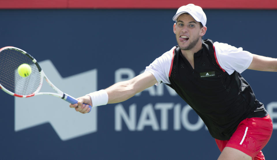 Dominic Thiem of Austria returns to Marin Cilic of Croatia during the Rogers Cup men’s tennis tournament Thursday, Aug. 8, 2019, in Montreal. (Paul Chiasson/The Canadian Press via AP)