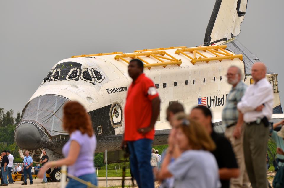 Space Shuttle Endeavour leaves the Orbiter Processing Facility on its way to the Vehicle Assembly Building (VAB) at Kennedy Space Center August 11, 2011 in Cape Canaveral, Florida. Space Shuttles Endeavour and Discovery switched buildings as they are being decommissioned with the end of the Shuttle program. (Photo by Roberto Gonzalez/Getty Images)