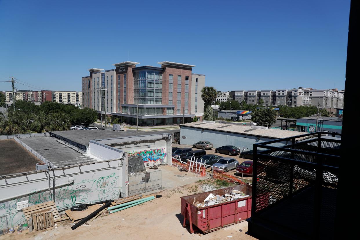 The entrance to the College Town district can be seen from the balcony of a unit in the Freight Yard, a new housing development in the All Saints neighborhood Thursday, April 22, 2019. 
