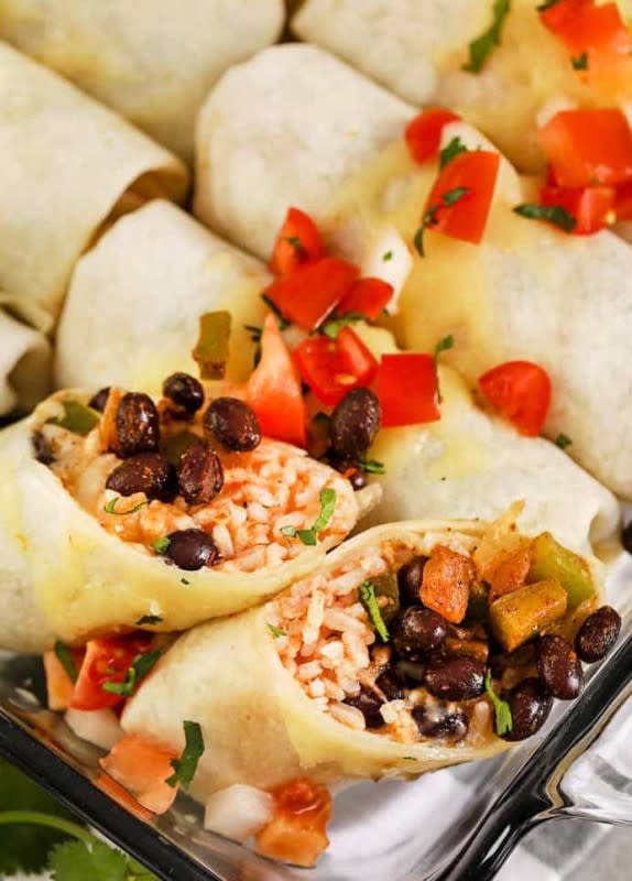 <p>Spend With Pennies</p><p>A great way to feed a hungry crowd using pantry staple ingredients. </p><p><strong>Cost $12.68</strong></p><p><strong>Get the recipe: <a href="https://www.spendwithpennies.com/cheesy-bean-burritos-freezer-friendly/" rel="nofollow noopener" target="_blank" data-ylk="slk:Cheesy Bean Burritos;elm:context_link;itc:0;sec:content-canvas" class="link rapid-noclick-resp">Cheesy Bean Burritos</a></strong></p>