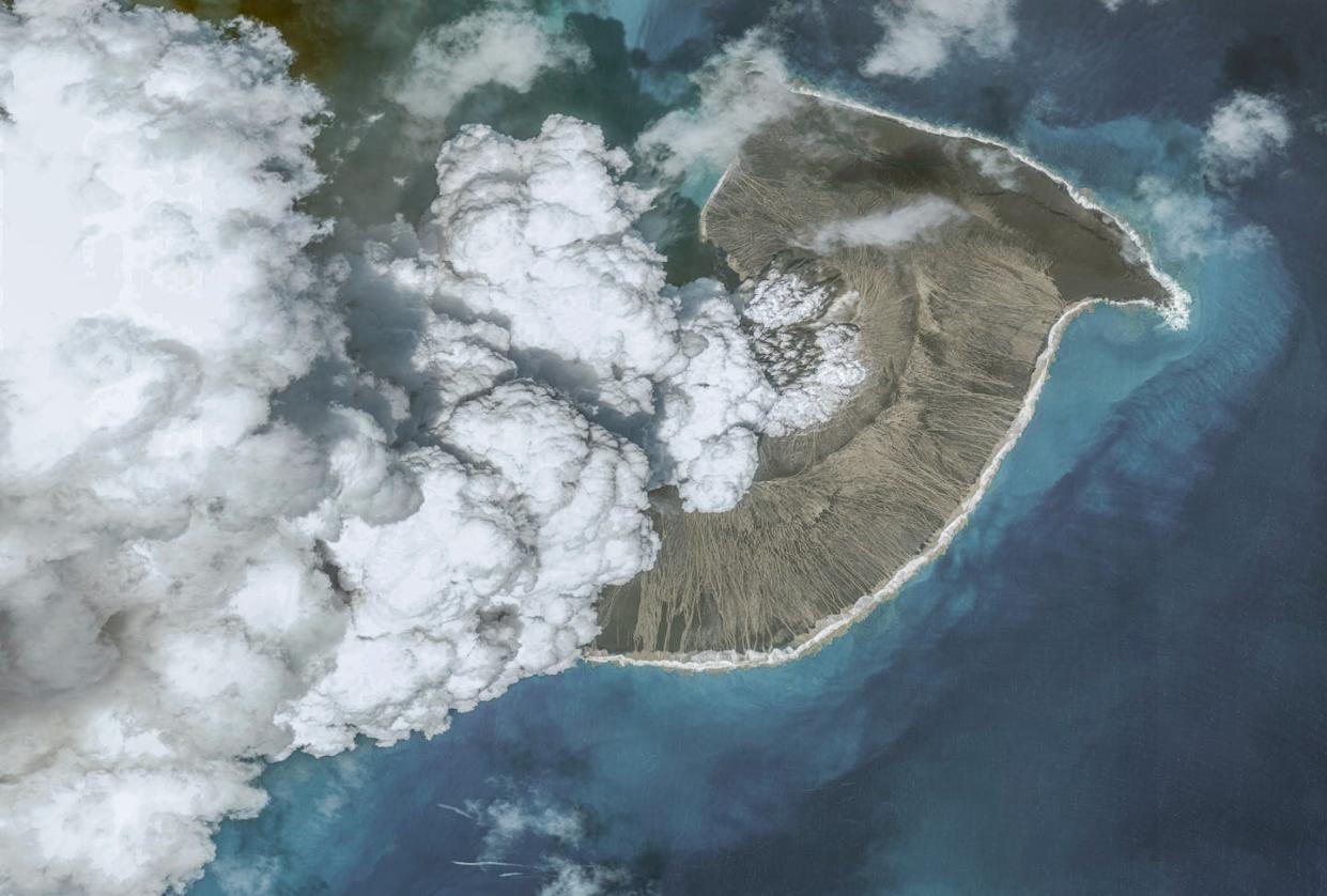 The volcano shortly before its eruption. <a href="https://www.gettyimages.com/detail/news-photo/in-this-image-2-of-a-series-created-on-january-19-maxar-news-photo/1237820698" rel="nofollow noopener" target="_blank" data-ylk="slk:Maxar via Getty Images;elm:context_link;itc:0;sec:content-canvas" class="link ">Maxar via Getty Images</a>