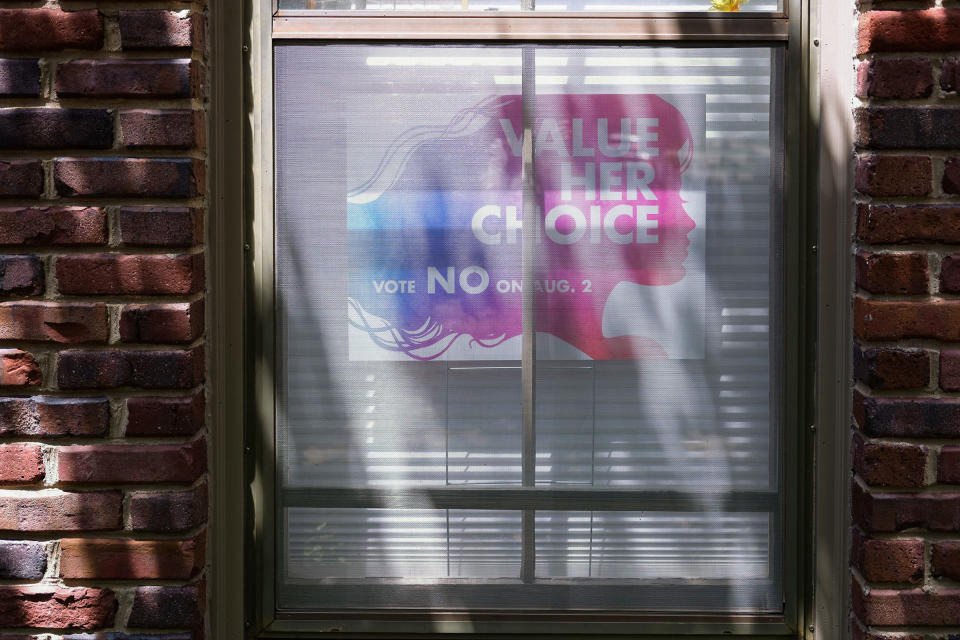 A 'Value Her Choice' sign is displayed in window of a home in Leawood.<span class="copyright">Arin Yoon for TIME</span>