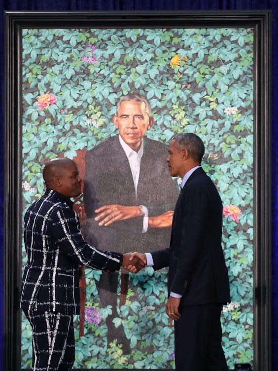 Kehinde Wiley with Barack Obama in front of his portrait in 2018 (Getty)