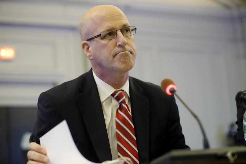 Michael Drewniak, chief spokesman for Gov. Chris Christie, listens to a question as he testifies Tuesday, May 13, 2014, before the state legislature's Select Committee on Investigation, in Trenton, N.J. The committee is probing the politically motivated closure of access lanes to the George Washington Bridge in Fort Lee, N.J., last September. (AP Photo/Mel Evans)