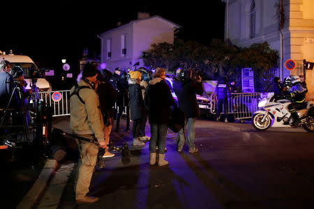 Journalists work in front of late French singer and actor Johnny Hallyday's home in Marnes-la-Coquette near Paris, France December 6, 2017. REUTERS/Benoit Tessier