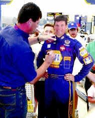 Michael Waltrip, pictured here in a file photo, will serve a stint as guest bartender on Tuesday at Daytona Beach International Airport.