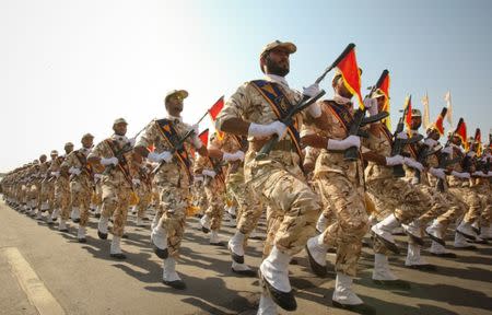 FILE PHOTO: Members of the Iranian revolutionary guard march during a parade to commemorate the anniversary of the Iran-Iraq war (1980-88), in Tehran September 22, 2011. REUTERS/Stringer/File Photo