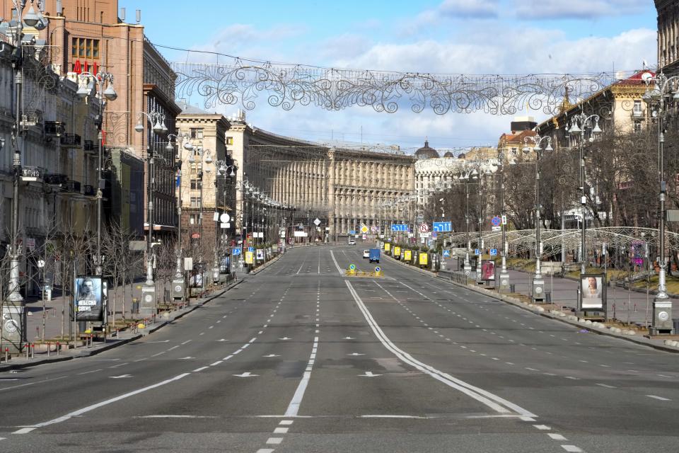 A view of Khreshchatyk, the main street, empty, due to curfew in the central of Kyiv, Ukraine, Sunday, Feb. 27, 2022. A Ukrainian official says street fighting has broken out in Ukraine's second-largest city of Kharkiv. Russian troops also put increasing pressure on strategic ports in the country's south following a wave of attacks on airfields and fuel facilities elsewhere that appeared to mark a new phase of Russia's invasion. (AP Photo/Efrem Lukatsky)