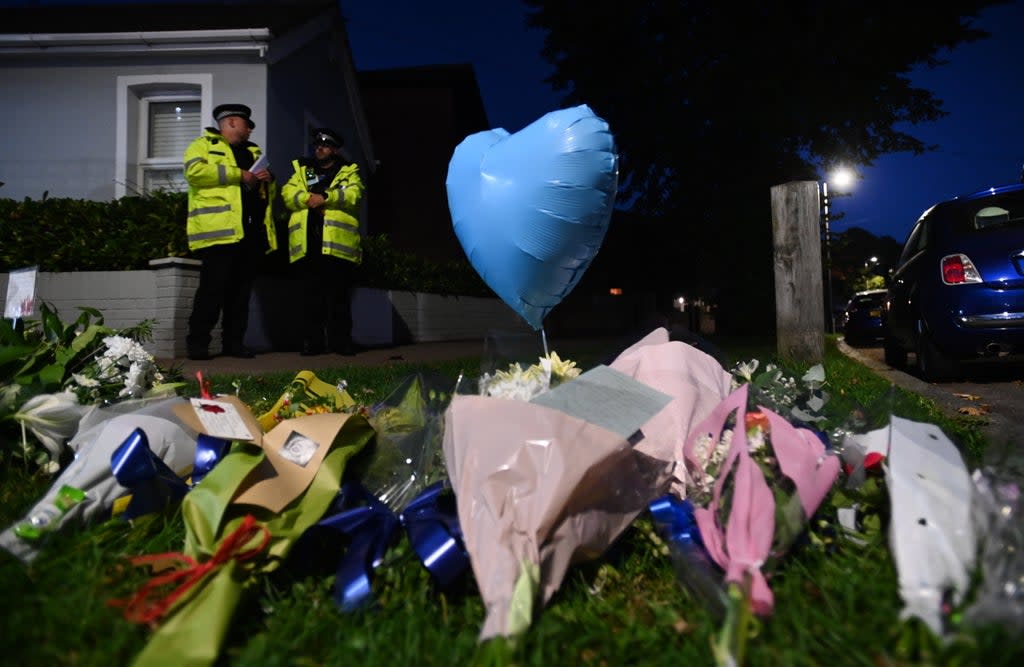 Floral tributes at the scene where the MP for Southend West, Sir David Amess, was stabbed to death in Leigh-on-Sea (EPA)