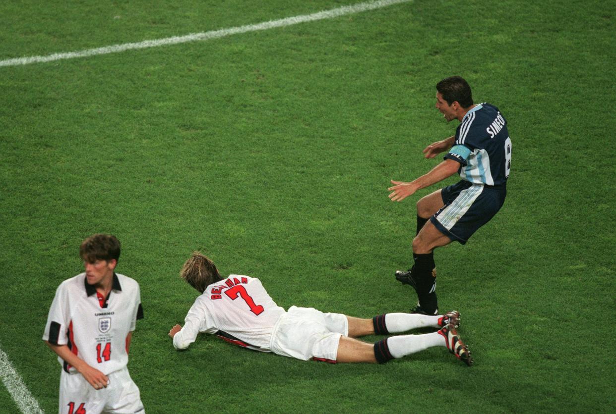 30 June 1998 - World Cup round of sixteen - Argentina v England, David Beckham aims a kick at Diego Simeone. (Photo by Mark Leech/Getty Images)