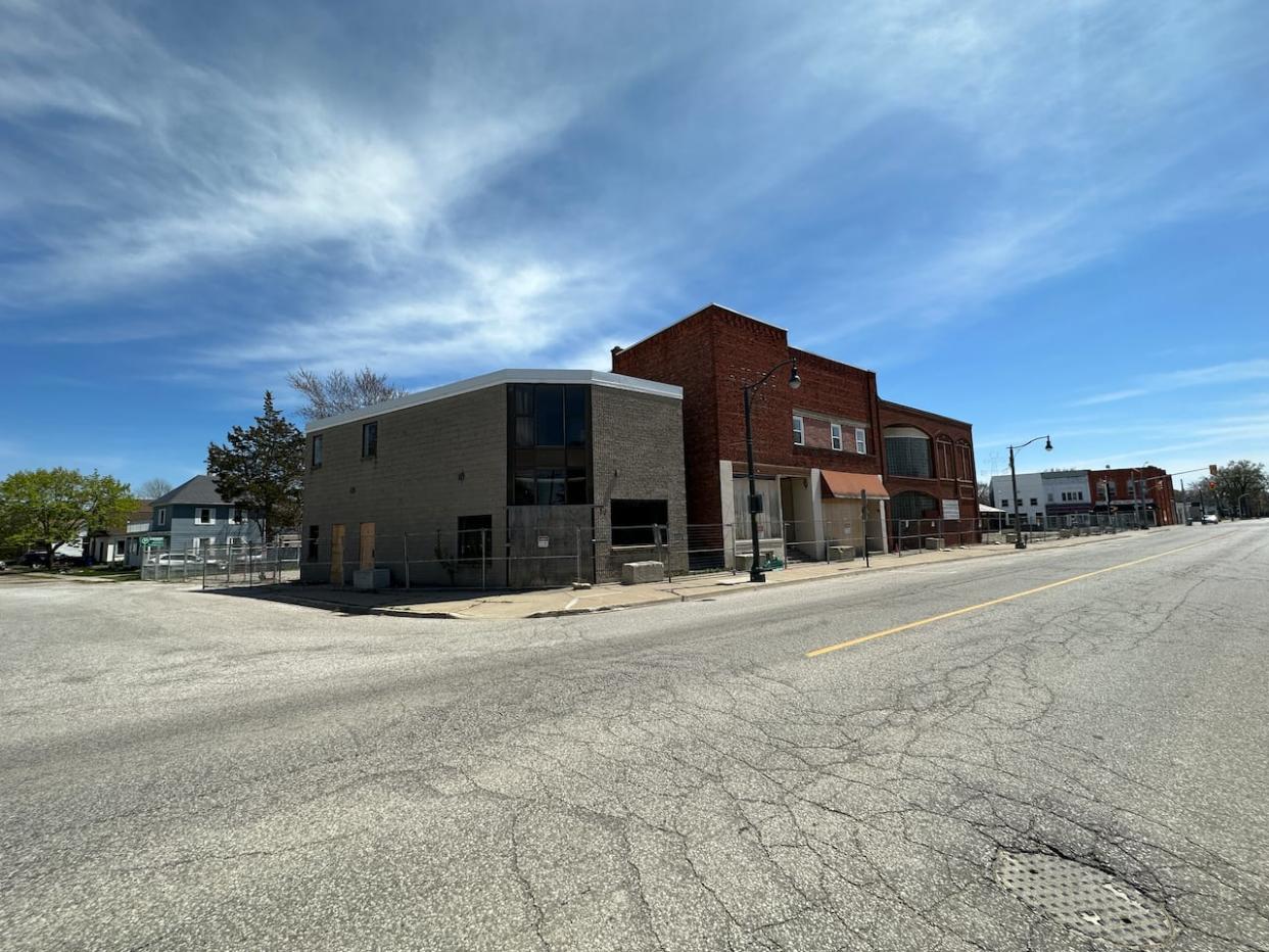 Nine buildings on Erie Street North and Talbot Street East in Wheatley, Ont., will be demolished soon, the town says. They have been vacant and fenced off since a downtown explosion in August 2021.  (Dale Molnar/CBC - image credit)