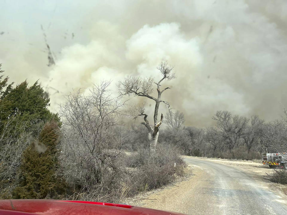 This image taken from Greenville Fire-Rescue's facebook page on Wednesday, Feb. 28, 2024 shows smoke from a fire in the Texas Panhandle. A fast-moving wildfire burning through the Texas Panhandle grew into the second-largest blaze in state history, forcing evacuations and triggering power outages as firefighters struggled to contain the widening flames. (Greenville Fire-Rescue via AP)