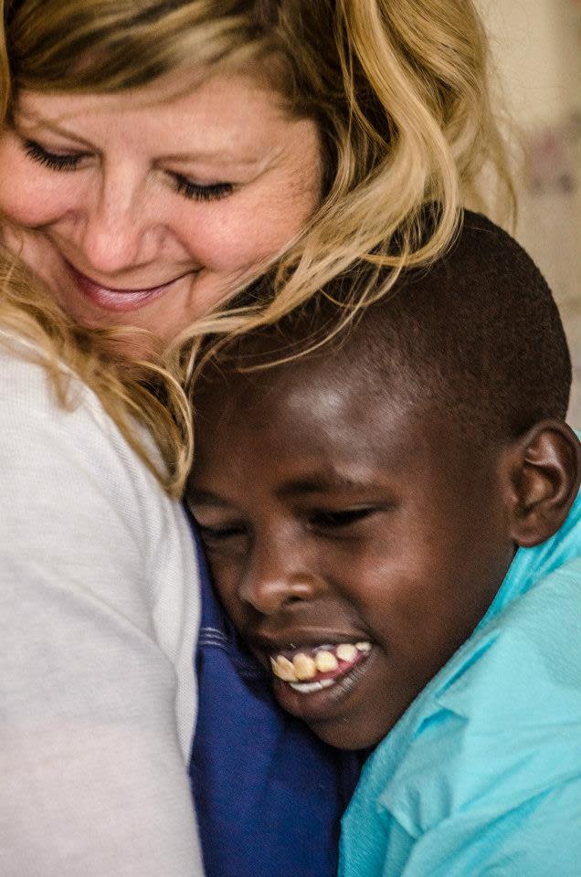 Beth Hadi, a cardiac nurse practitioner at Dell Children's Medical Center, meets with a boy at a clinic in Kenya. A group of Austin medical professionals made regular trips to Kenya in cooperation with Austin-based Ubuntu Life Foundation.