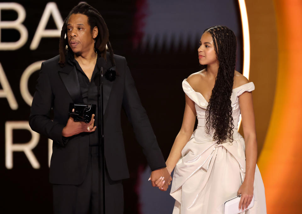 LOS ANGELES, CALIFORNIA - FEBRUARY 04: (LR) Honoree Jay-Z accepts the Dr. Dre Global Impact Award with Blue Ivy Carter onstage during the 66th GRAMMY Awards at Crypto.com Arena on February 04, 2024 in Los Angeles, California. (Photo by Kevin Winter/Getty Images for The Recording Academy)