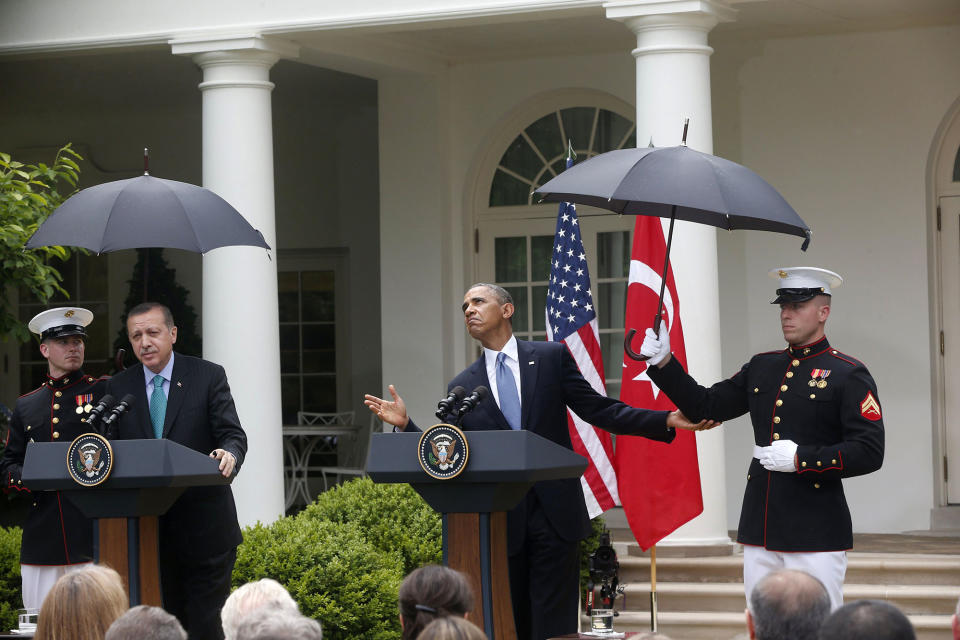 <p>President Barack Obama, accompanied by Turkish Prime Minister Recep Tayyip Erdogan checks for rain during their joint news conference in the Rose Garden of the White House in Washington, Thursday, May 16, 2013. (AP Photo/Charles Dharapak) </p>