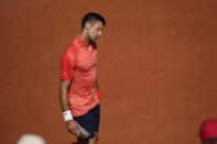 Serbia's Novak Djokovic holds a box with some fruit during the quarterfinal match of the French Open tennis tournament against Russia's Karen Khachanov at the Roland Garros stadium in Paris, Tuesday, June 6, 2023. (AP Photo/Thibault Camus)