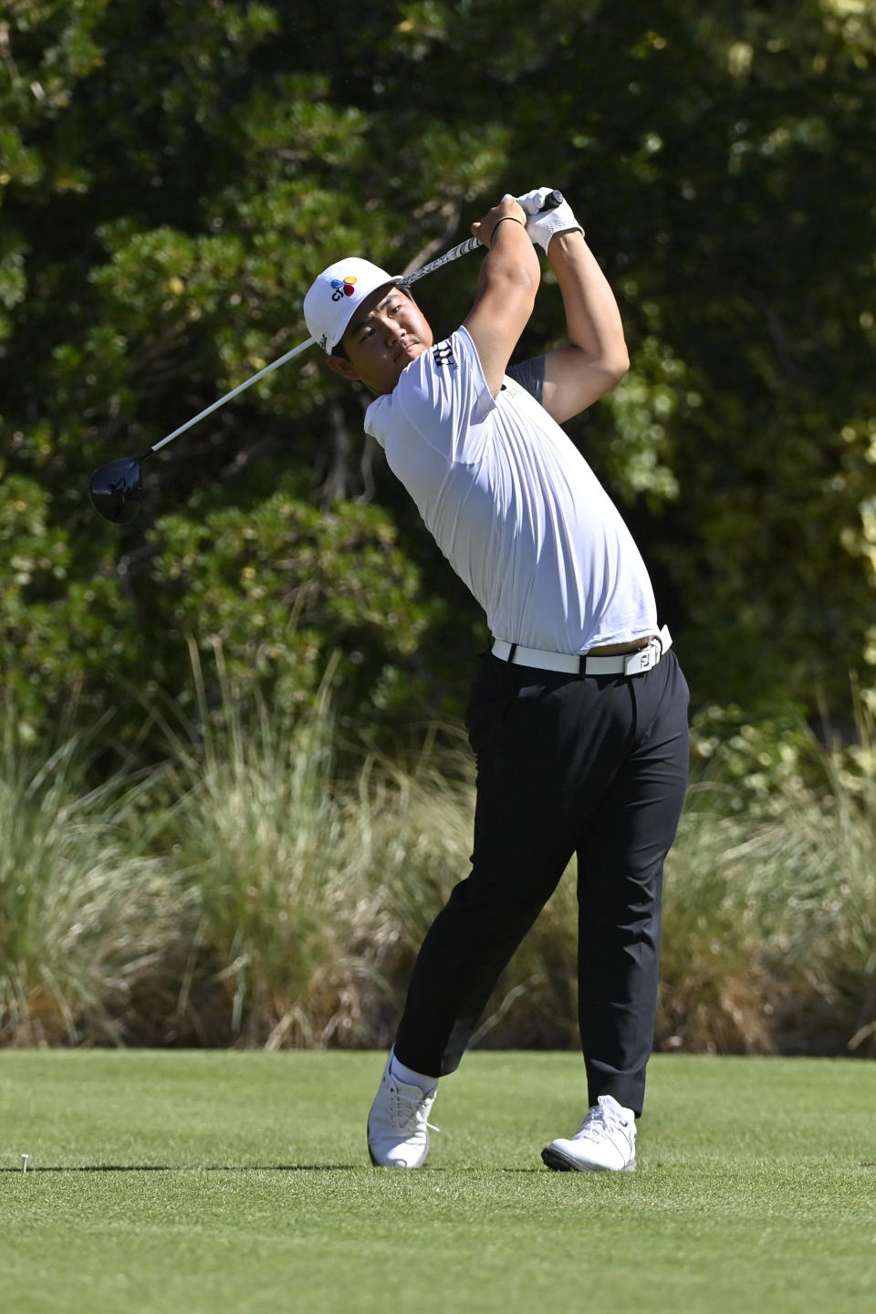 Tom Kim, of South Korea, plays his tee shot on the third hole during the final round of the Shriners Children's Open golf tournament, Sunday, Oct. 9, 2022, in Las Vegas. (AP Photo/David Becker)