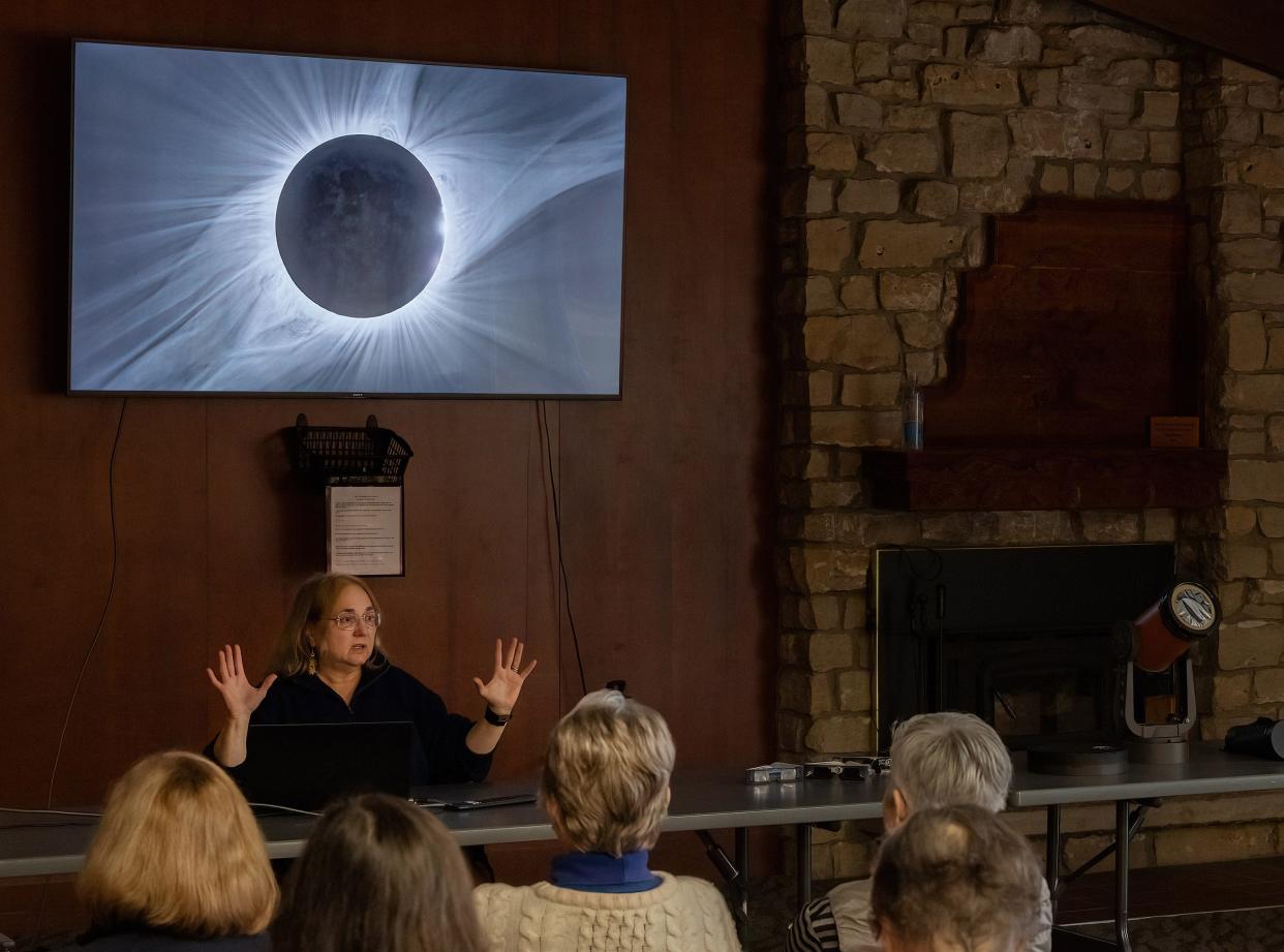 Robin Gill, astronomy education specialist at The Wilderness Center in Sugar Creek Township, conducts a program to teach those interested how to successfully and safely view the solar eclipse.