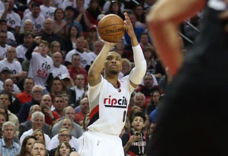 Portland Trail Blazers guard Damian Lillard (0) shoots a three-point shot against the Los Angeles Clippers in the second half in game four of the first round of the NBA Playoffs at Moda Center at the Rose Quarter. Mandatory Credit: Jaime Valdez-USA TODAY Sports