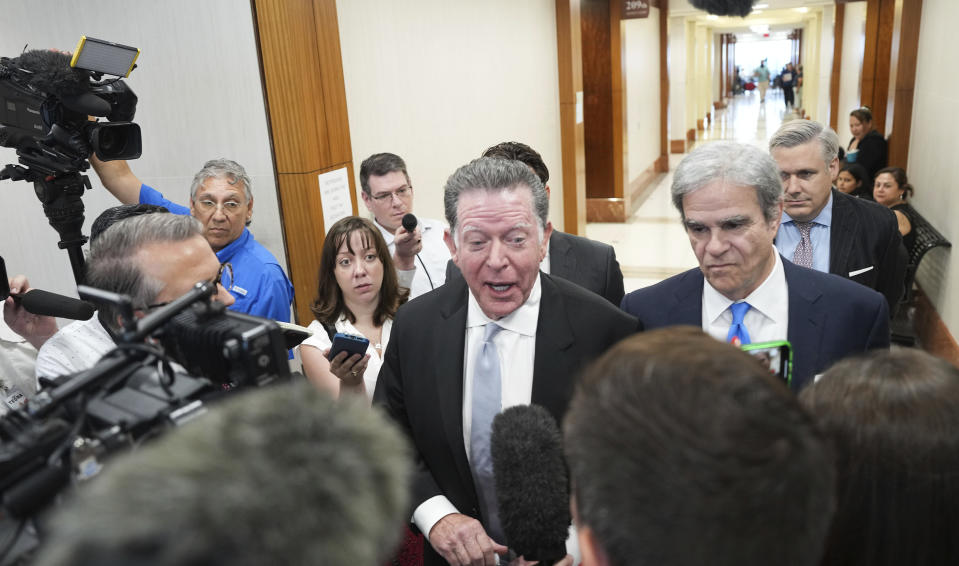 Dan Cogdell, defense attorney for suspended Texas Attorney General Ken Paxton, talks to the media after a court appearance at Harris County Courthouse on Thursday, Aug. 3, 2023 in Houston. Embattled Texas Attorney General Ken Paxton's years-delayed trial on securities fraud charges will have to wait until his separate impeachment trial is concluded, lawyers and the judge in the case said Thursday. (Elizabeth Conley/Houston Chronicle via AP)