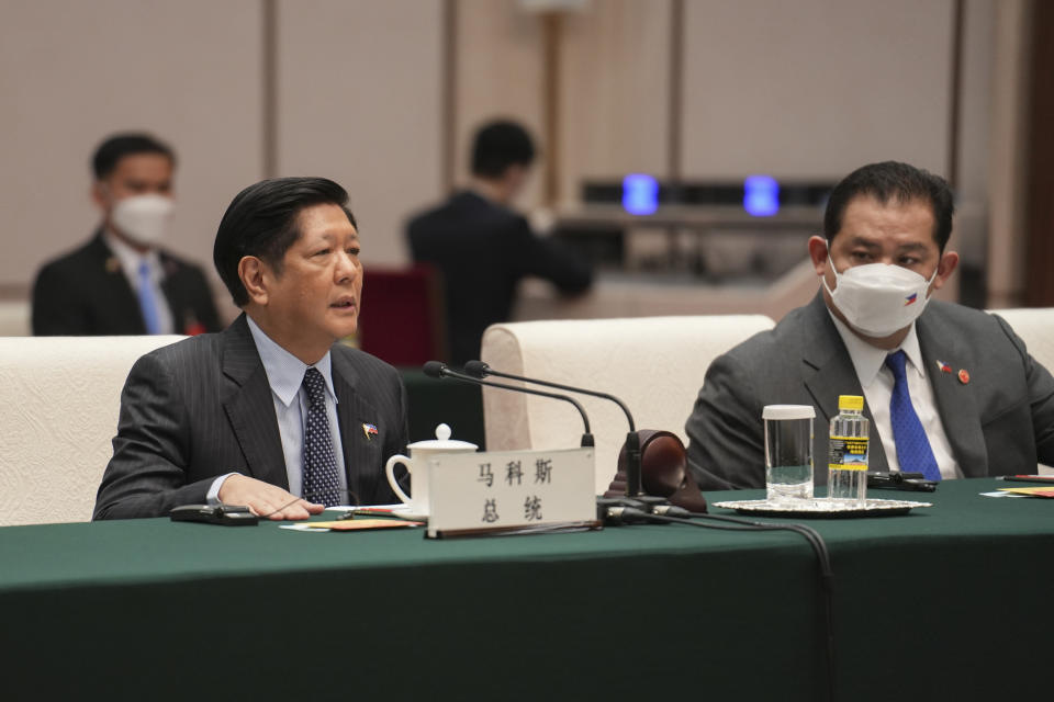 In this handout photo provided by the Malacanang Presidential Photographers Division, Philippine President Ferdinand Marcos Jr., left, speaks during his meeting with China's Chairman of the Standing Committee of the National People's Congress Li Zhanshu, not shown, at the Great Hall of the People, in Beijing, China, Wednesday Jan. 4, 2023. (Malacanang Presidential Photographers Division via AP)