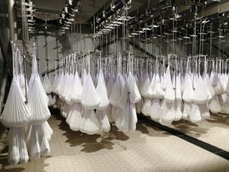 Bags of milk are seen in the dairy factory at Baladna farm in the city of Al-Khor