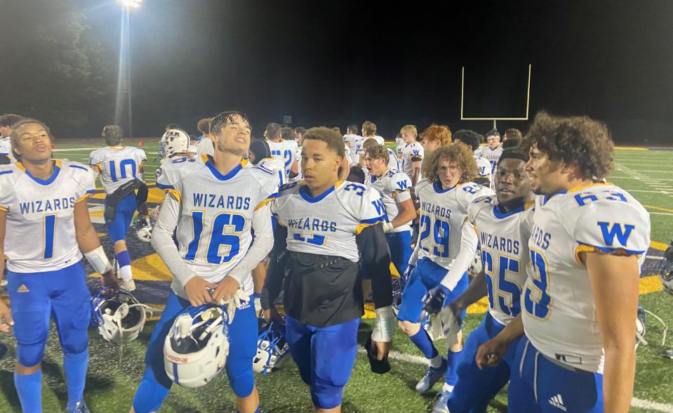 The Washingtonville football team shows its excitement while leaving the field after an overtime upset of Our Lady of Lourdes on Sept. 22, 2023.