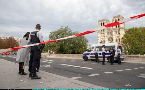 Police personnel block the bridge near Paris Police headquarters after four officers were killed in a knife attack on October 3, 2019  - Credit: Marc Piasecki&nbsp;/Getty Images Europe&nbsp;