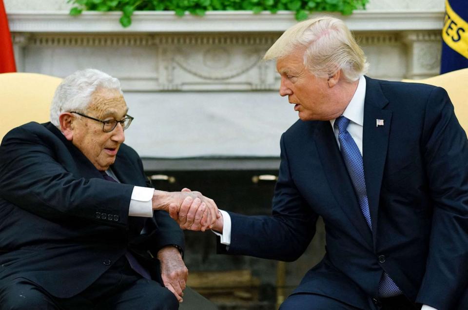 PHOTO: FILE - President Donald Trump shakes hands with former Secretary of State Henry Kissinger during their meeting in the Oval Office of the White House in Washington, DC, Oct.10, 2017. (Mandel Ngan/AFP via Getty Images, FILE)
