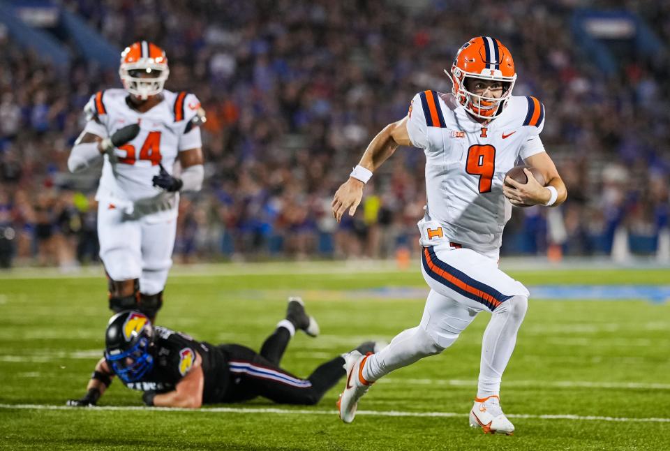 Sep 8, 2023; Lawrence, Kansas, USA; Illinois Fighting Illini quarterback Luke Altmyer (9) runs for a touchdown against the Kansas Jayhawks during the second half at David Booth Kansas Memorial Stadium. Mandatory Credit: Jay Biggerstaff-USA TODAY Sports