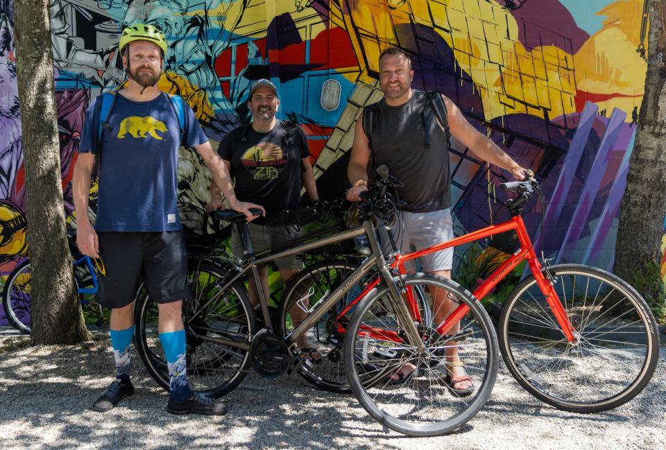 JC Thomas, from San Francisco, and Hudson Gilbert and Brigham Pierce, from San Diego, bike through Provincetown on a sunny Wednesday morning.