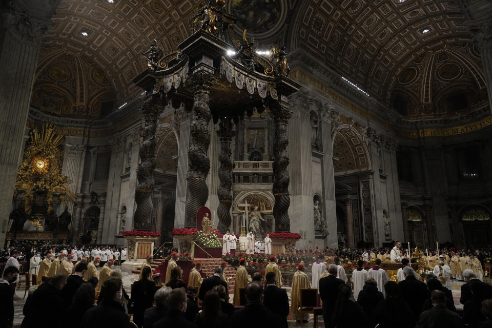 Pope Francis celebrates Christmas Eve Mass, at St. Peter's Basilica, at the Vatican, Friday Dec. 24, 2021. Pope Francis is celebrating Christmas Eve Mass before an estimated 1,500 people in St. Peter's Basilica. He's going ahead with the service despite the resurgence in COVID-19 cases that has prompted a new vaccine mandate for Vatican employees. (AP Photo/Alessandra Tarantino)