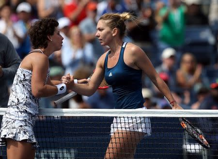 Sep 5, 2016; New York, NY, USA; Simona Halep of Romania (right) shakes hands with Carla Suarez Navarro of Spain after their match on day eight of the 2016 U.S. Open tennis tournament at USTA Billie Jean King National Tennis Center. Mandatory Credit: Jerry Lai-USA TODAY Sports