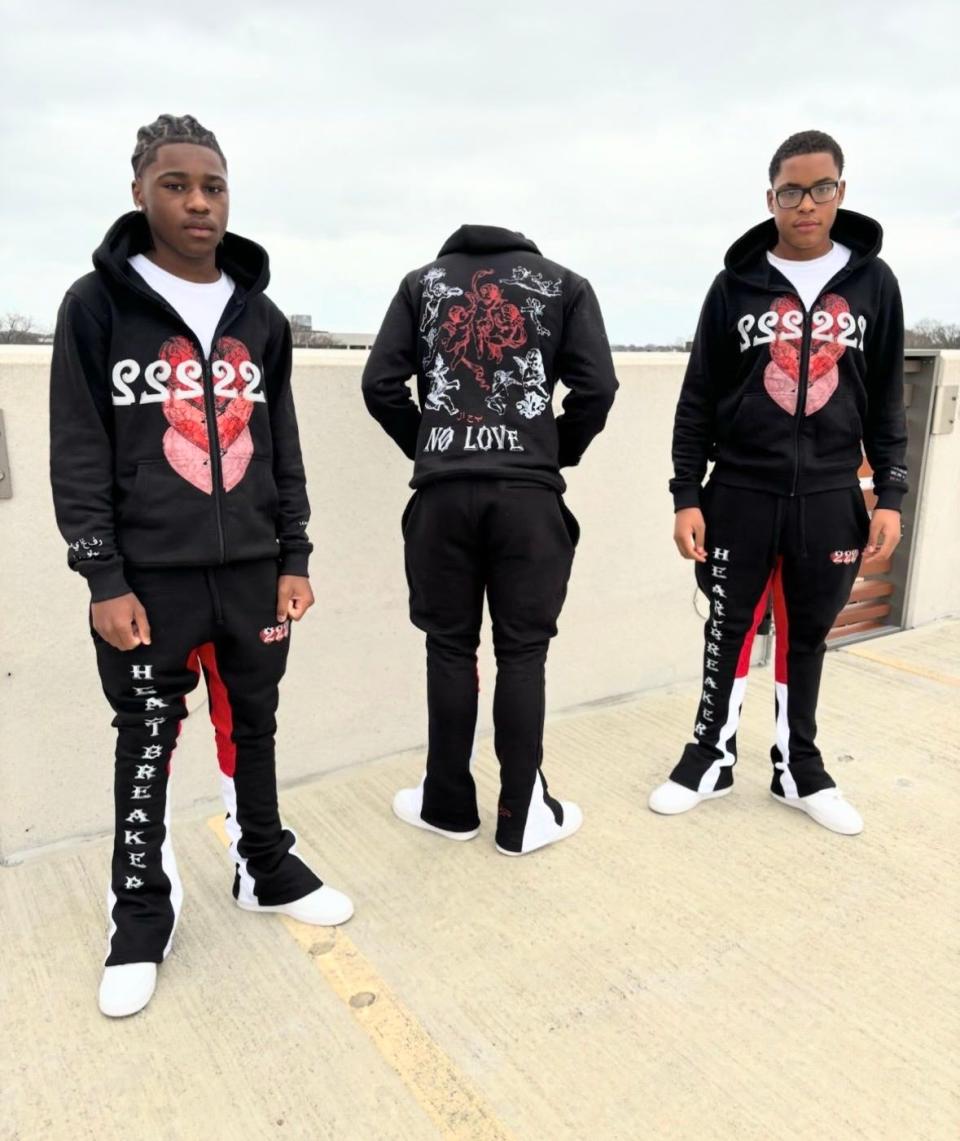 Brockton middle schoolers Jaziah Xavier Wilson,14, left, and Jonathan Robalo,13, and their model, center, sport Wilson and Robalo's newly launched clothing brand The 222 Apparel. They started this brand in hopes of being like other popular brands in Brockton including Banks & Branco, Dreams From The East and Cash's Closet.