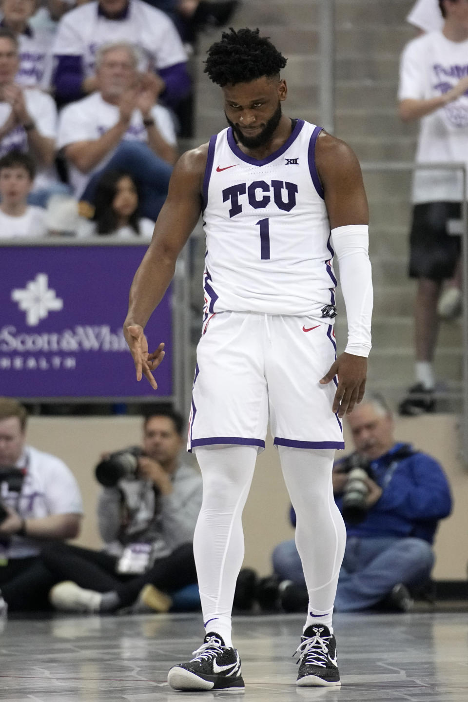 TCU guard Mike Miles Jr. celebrates after sinking a 3-point basket in the second half of an NCAA college basketball game, Monday, Feb. 20, 2023, in Fort Worth, Texas. (AP Photo/Tony Gutierrez)