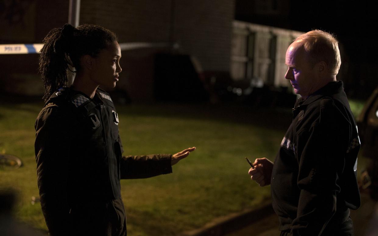 Thandie Newton as DCI Huntley and Jason Watkins as Tim Ifield in Line of Duty - WARNING: Use of this copyright image is subject to the terms of use of BBC Pictures' Digital Picture Service (BBC Pictures) as set out at www.bbcpictures.co.uk. In particular, this image may only be published by a registered User of BBC Pictures for editorial use for the purpose of publicising the relevant BBC programme, personnel or activity during the Publicity Period which ends three review weeks following the date of transmission and provided the BBC and the copyright holder in the caption are credited. For any other purpose whatsoever, including advertising and commercial, prior written approval from the copyright holder will be required.