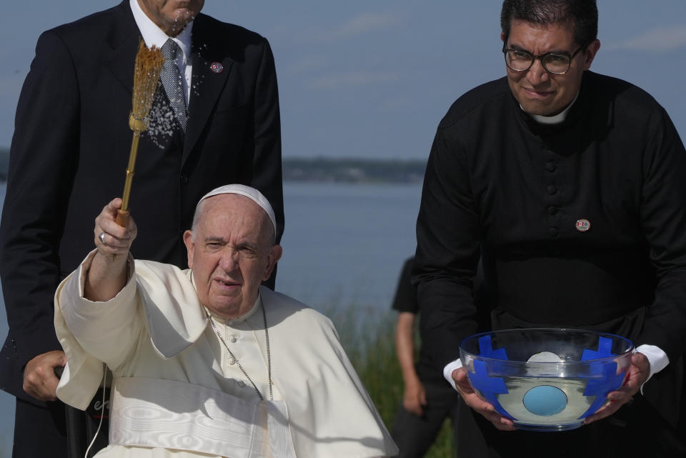 Pope Francis blesses as he arrives at the Lac Ste. Anne pilgrimage site in Alberta, Canada, Tuesday, July 26, 2022. Pope Francis crisscrossed Canada this week delivering long overdue apologies to the country's Indigenous groups for the decades of abuses and cultural destruction they suffered at Catholic Church-run residential schools. (AP Photo/Gregorio Borgia)