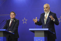 Albania's Prime Minister Edi Rama, right, makes statements with European Commissioner for Neighbourhood and Enlargement Oliver Varhelyi during a press conference with in Tirana, Albania, Thursday, Feb. 29, 2024. The leaders of Western Balkan countries met Thursday in another joint push to use the European Union's financial support plan of six billion euros (about $6.5 billion) hoping it will speed up its membership in the bloc. (AP Photo/Armando Babani)