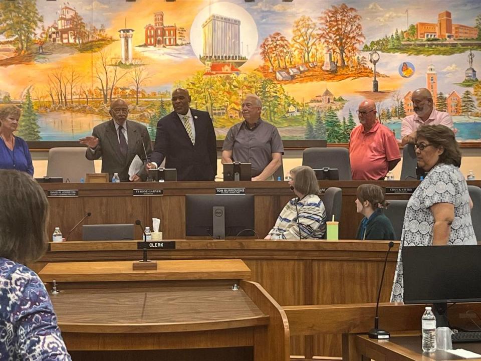 Chester Owens, left, a longtime civil rights leader and historian in Kansas City, Kansas, was honored Thursday with a key to the city and the renaming of one block of 12th Street.