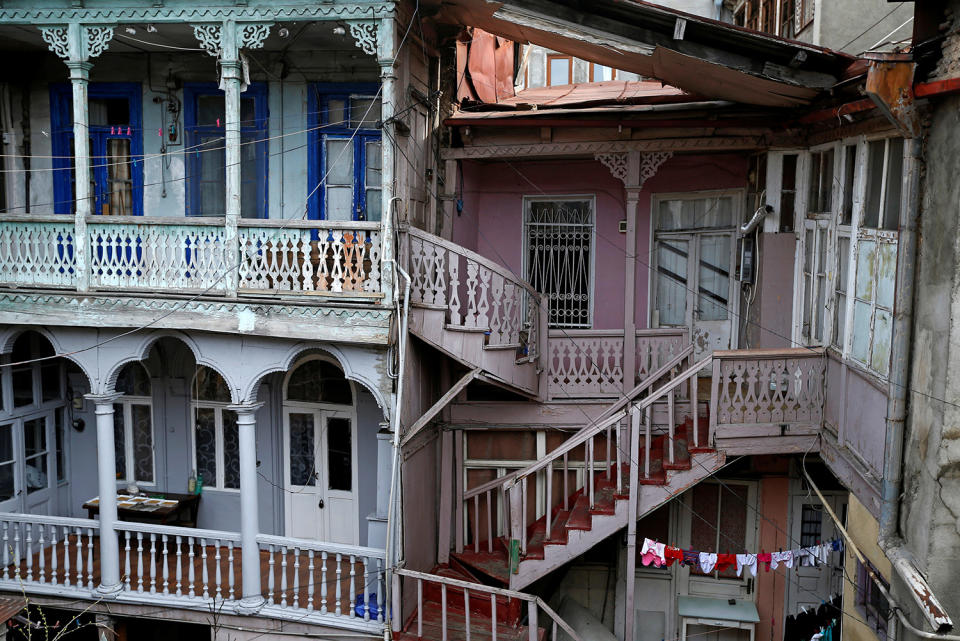 <p>Wooden stairs and balconies are seen in a courtyard in the old town, Tbilisi, Georgia, April 6, 2017. (Photo: David Mdzinarishvili/Reuters) </p>