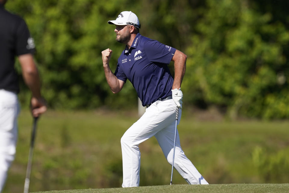 Marc Leishman, of Australia, reacts after making a putt on the 16th green during the final round of the PGA Zurich Classic golf tournament at TPC Louisiana in Avondale, La., Sunday, April 25, 2021. (AP Photo/Gerald Herbert)