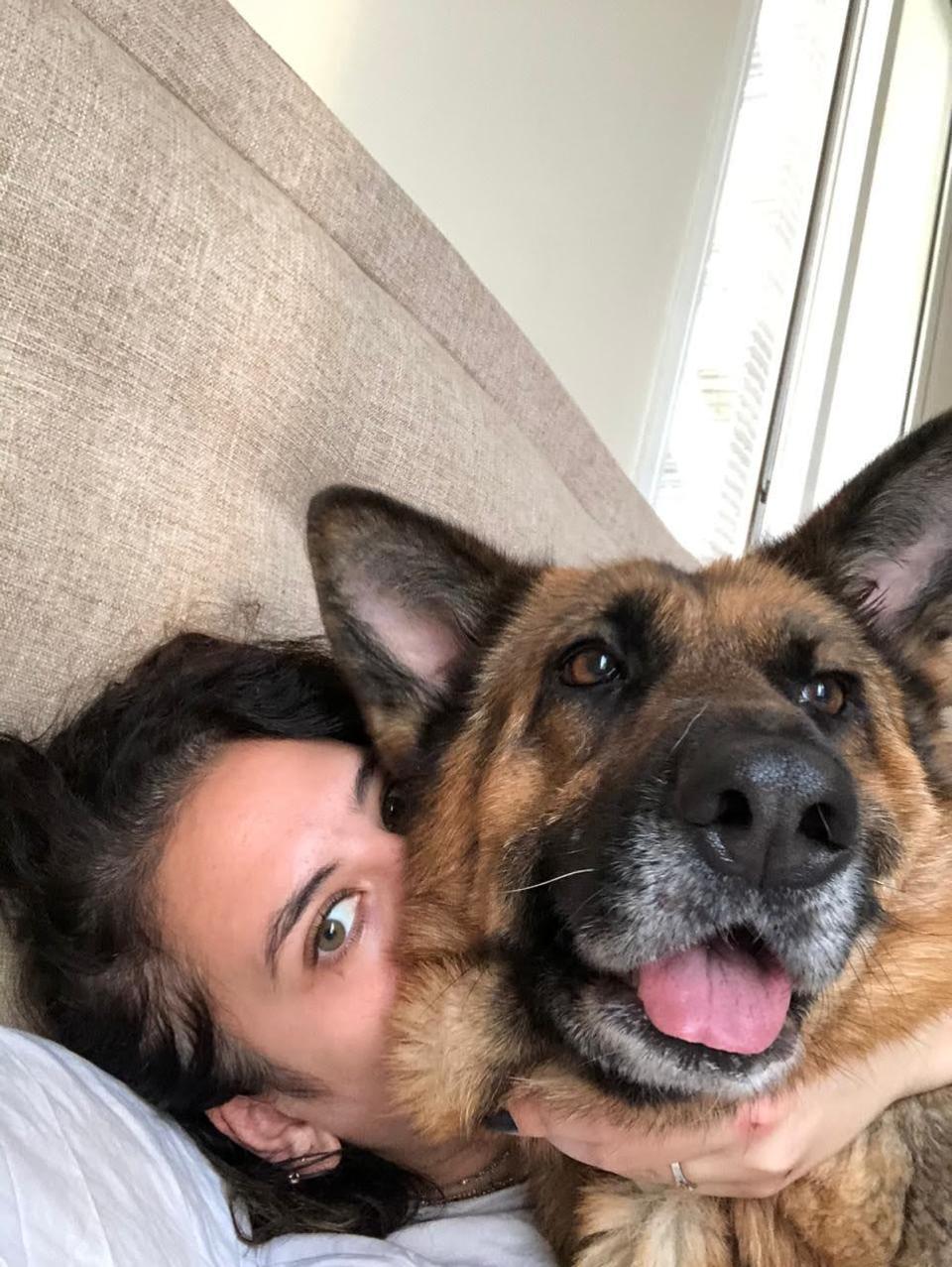 Beirut-based journalist Nadia al-Faour hugs her dog Loulou, a German shepherd rescue. Loulou died in the Aug. 4, 2020 explosion.