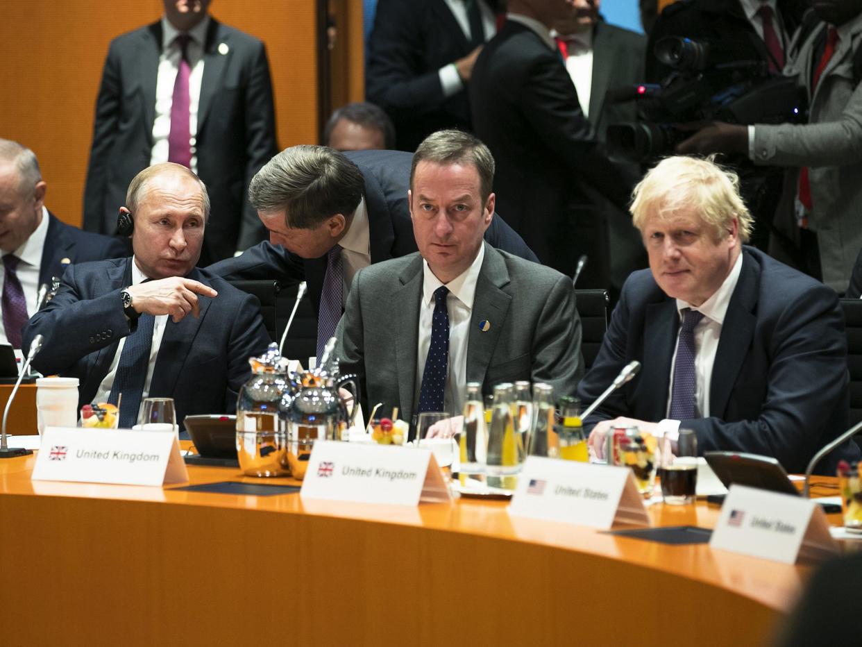 Boris Johnson and Vladimir Putin are pictured before the beginning of the meeting in Berlin, Germany: Getty Images