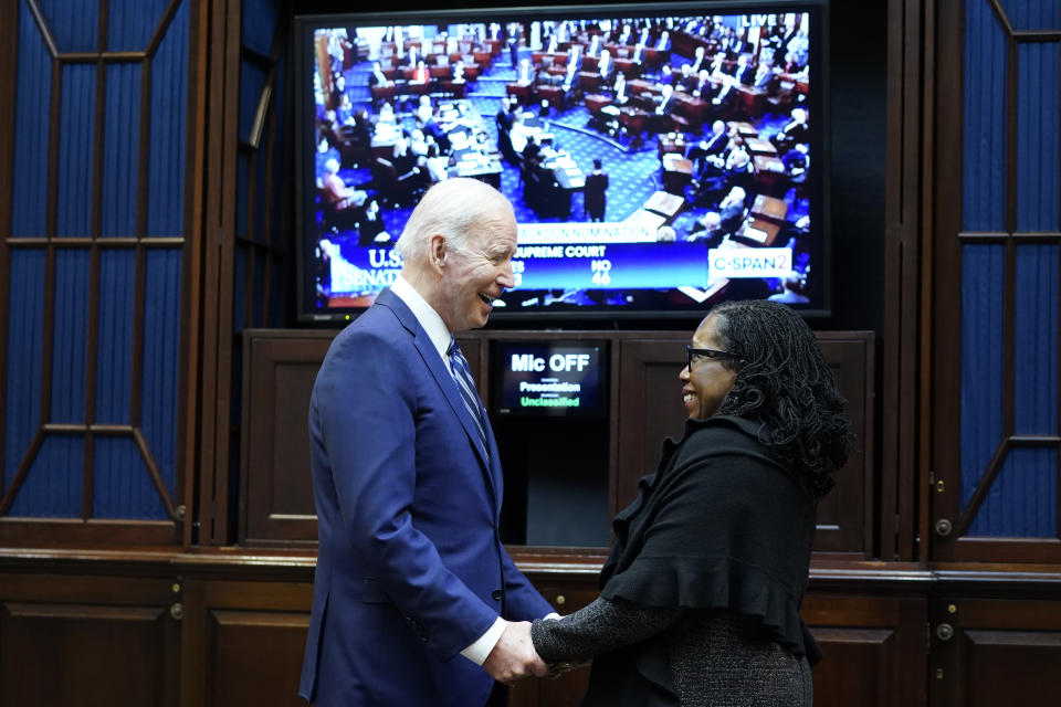 FILE - President Joe Biden talks with Supreme Court nominee Judge Ketanji Brown Jackson as they watch the Senate vote on her confirmation from the Roosevelt Room of the White House in Washington, April 7, 2022. The first Black woman confirmed for the Supreme Court, Jackson, is officially becoming a justice. Jackson will be sworn as the court’s 116th justice at midday Thursday, June 30, just as the man she is replacing, Justice Stephen Breyer, retires. (AP Photo/Susan Walsh, File)