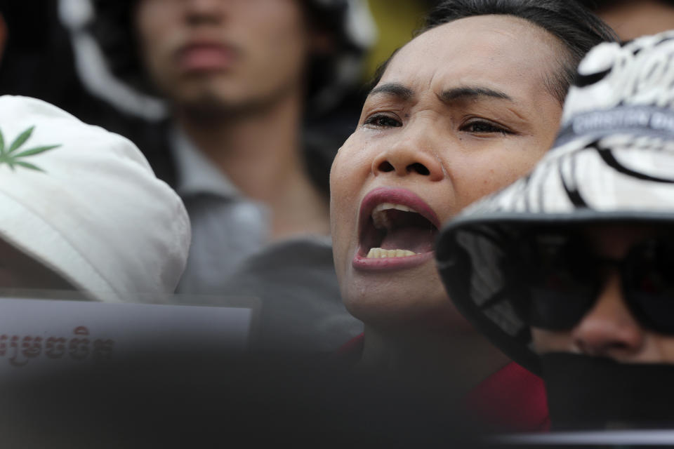 A supporter to NagaWorld's union leader Chhim Sithar, joins a protest in front of Phnom Penh Municipal Court in Phnom Penh Cambodia, Thursday, May 25, 2023. Chhim Sithar who led a long-running strike against Cambodia’s biggest casino was sentenced Thursday to two years in prison for incitement to commit a felony, while eight fellow union members received lesser terms that do not include time behind bars. (AP Photo/Heng Sinith)