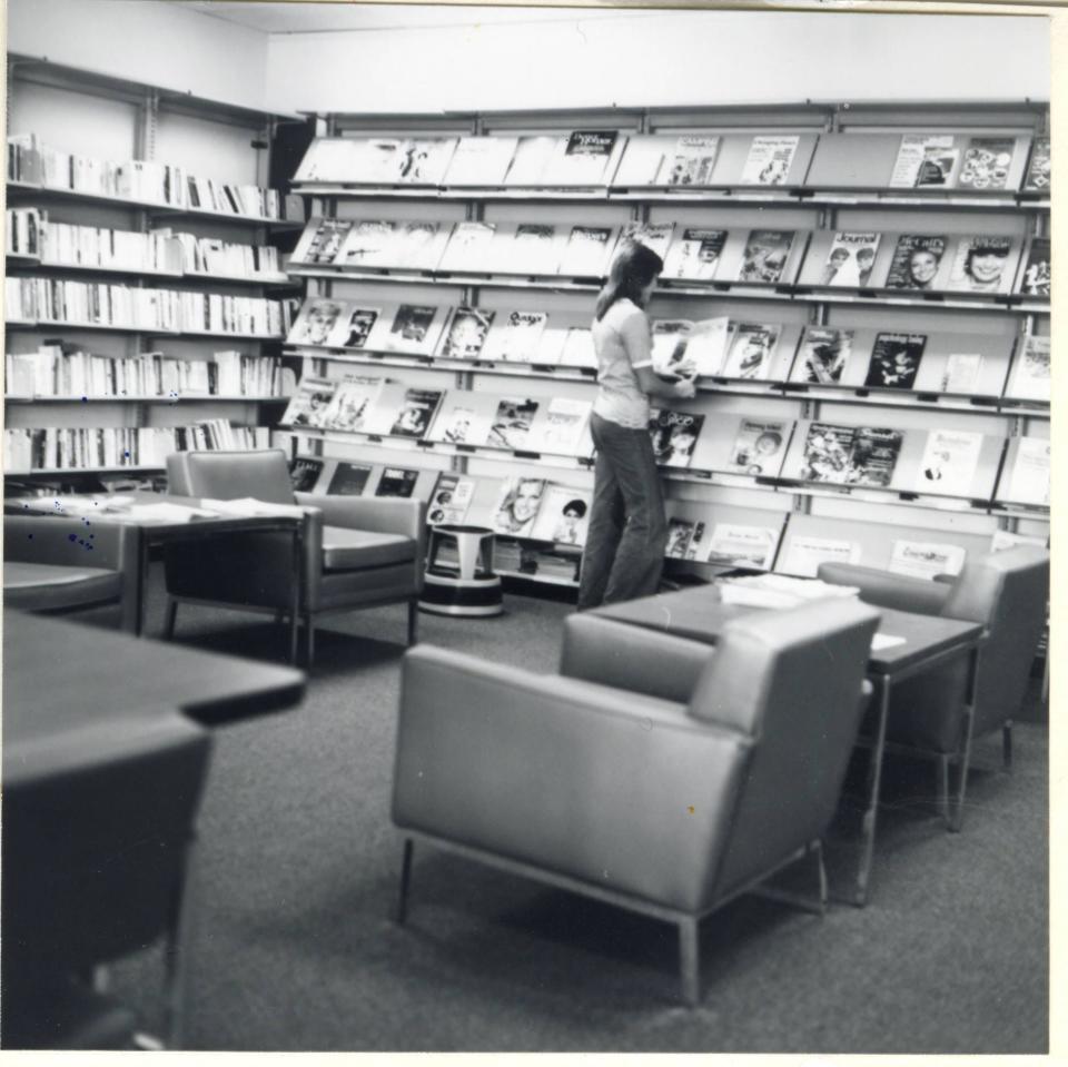 The Hilltonia Branch of the Public Library of Columbus and Franklin County (later renamed the Columbus Metropolitan Library) moved from its original location at 2282 West Mound Street to 2224 Eakin Road in 1976.  This view of the adult lounge area in the newly opened Eakin Road location features a wide array of magazines.