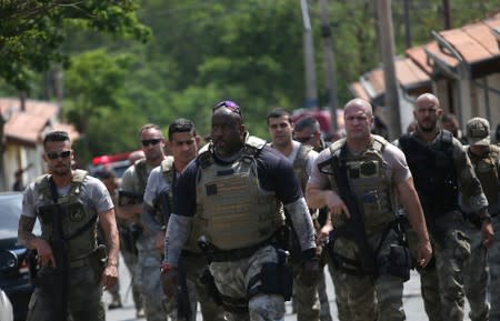 Federal police officers are seen after an armed gang robbed a securities company at the Viracopos airport freight terminal, in Campinas