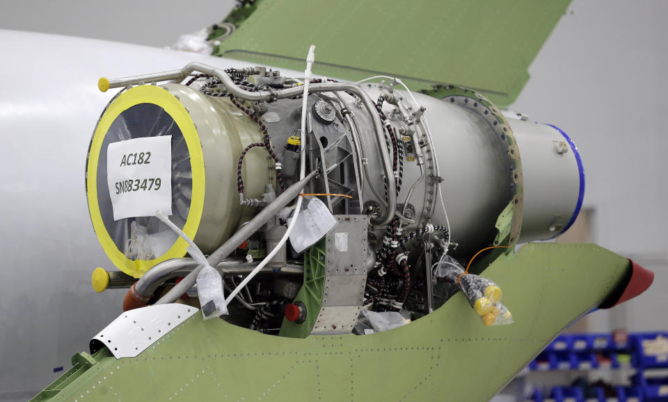 This July 30, 2019 shows an engine being installed on a HondaJet aircraft during production at the Honda Aircraft Co. headquarters in Greensboro, N.C. Nearly four years after delivering its first jet, Honda is facing decisions as the company better known for cars and lawnmowers considers whether to sink billions more into its decades-in-the-making aircraft division. (AP Photo/Gerry Broome)