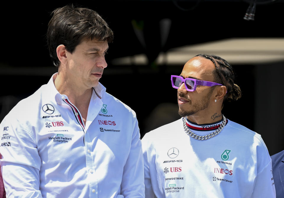 Pictured left to right, Mercedes team principal Toto Wolff and star driver Lewis Hamilton talking prior to the Miami Grand Prix. 